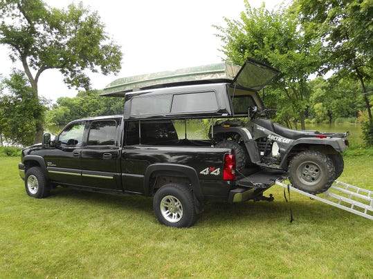 EZ lift lets truck bed cap rise, convert to camper